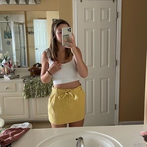 Yellow zip/button/tie skirt